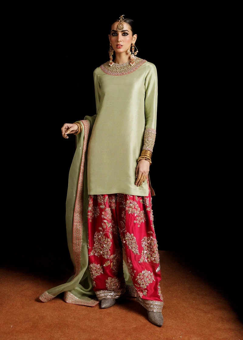 Doron Pakistani fashion outfit in orange, pink, green, silver tones.