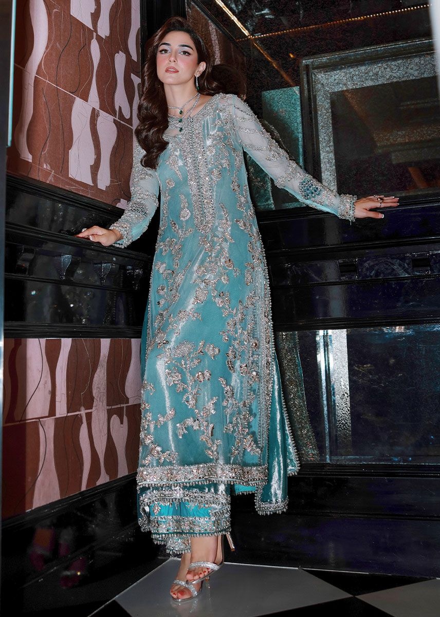 Ferozeah pakistani fashion outfit with coordinated formal styling.