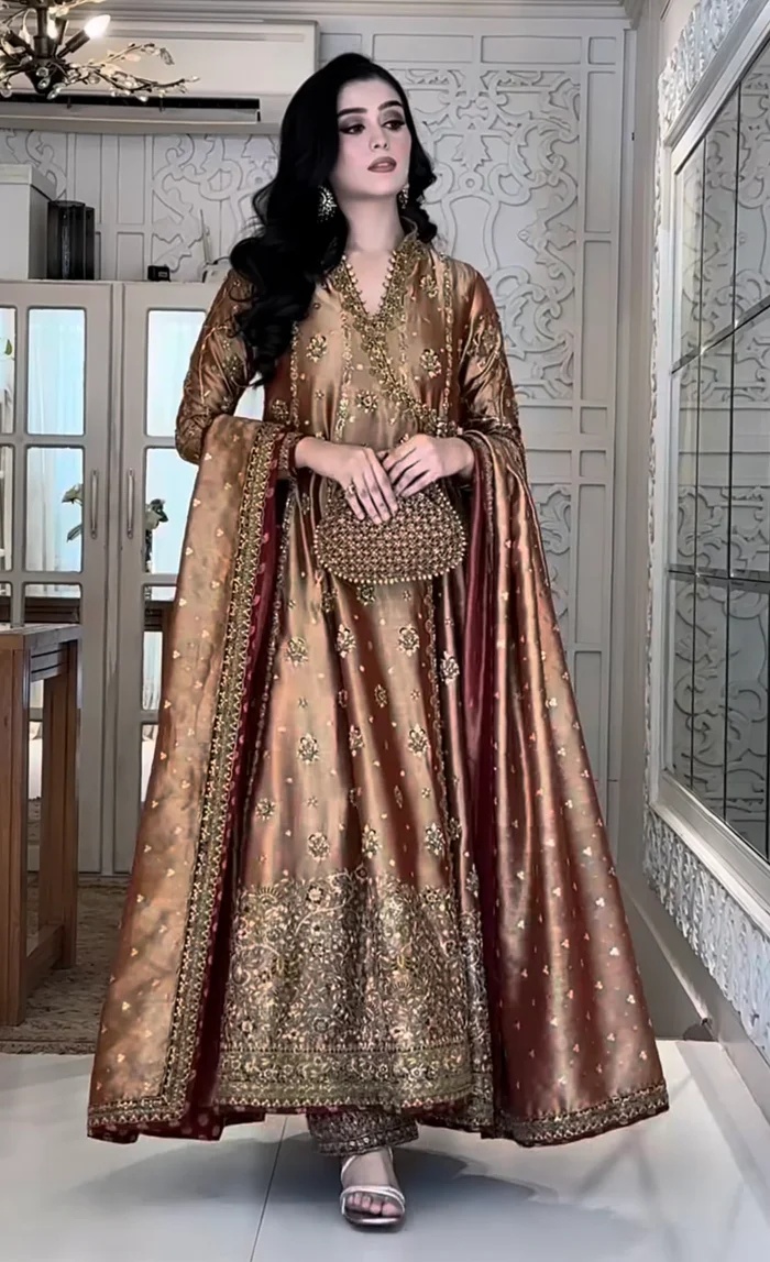 Haris Shakeel Aswad Pakistani fashion outfit in gold tones.