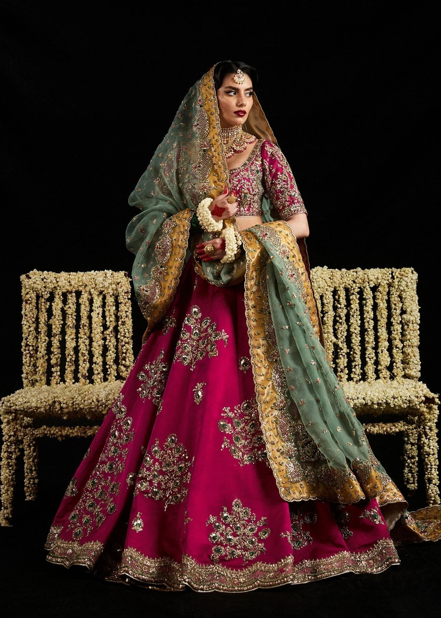 Laal pakistani fashion outfit in pink tones.