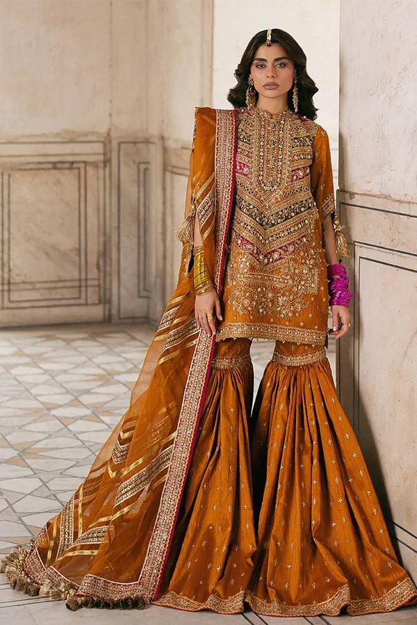 Mohsin Naveed Ranjha – Ranjish pakistani fashion outfit with coordinated formal styling.