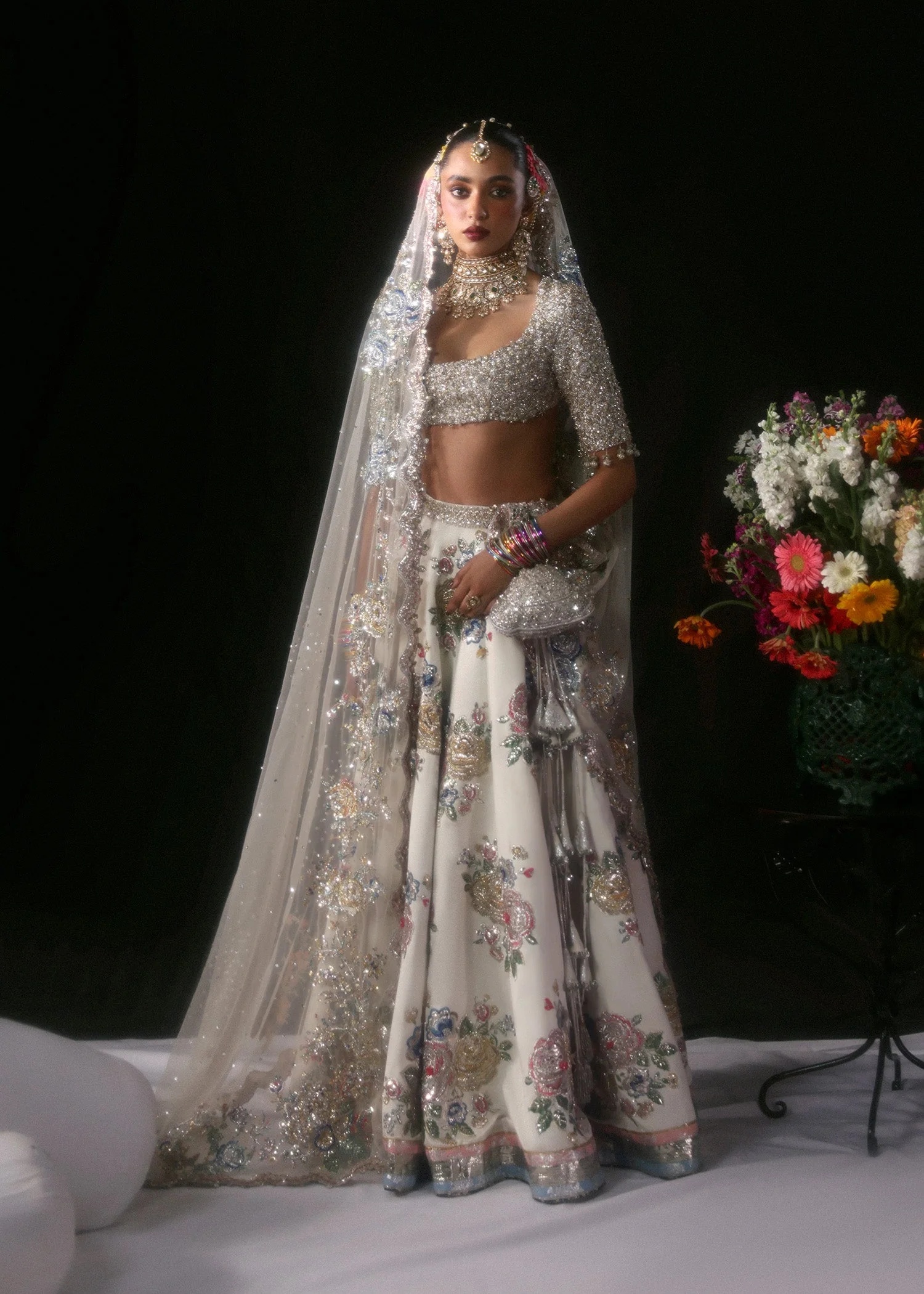 Raks Pakistani fashion outfit in ivory, silver tones.