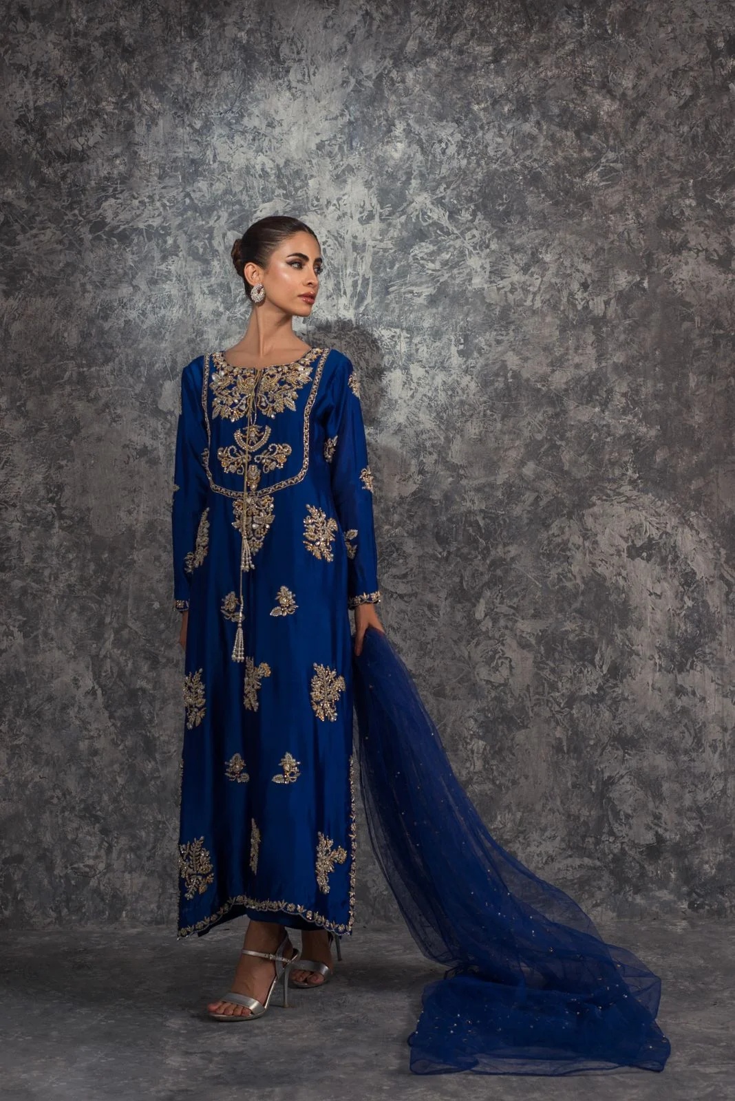 Royal Blue pakistani fashion outfit in gold, blue tones.