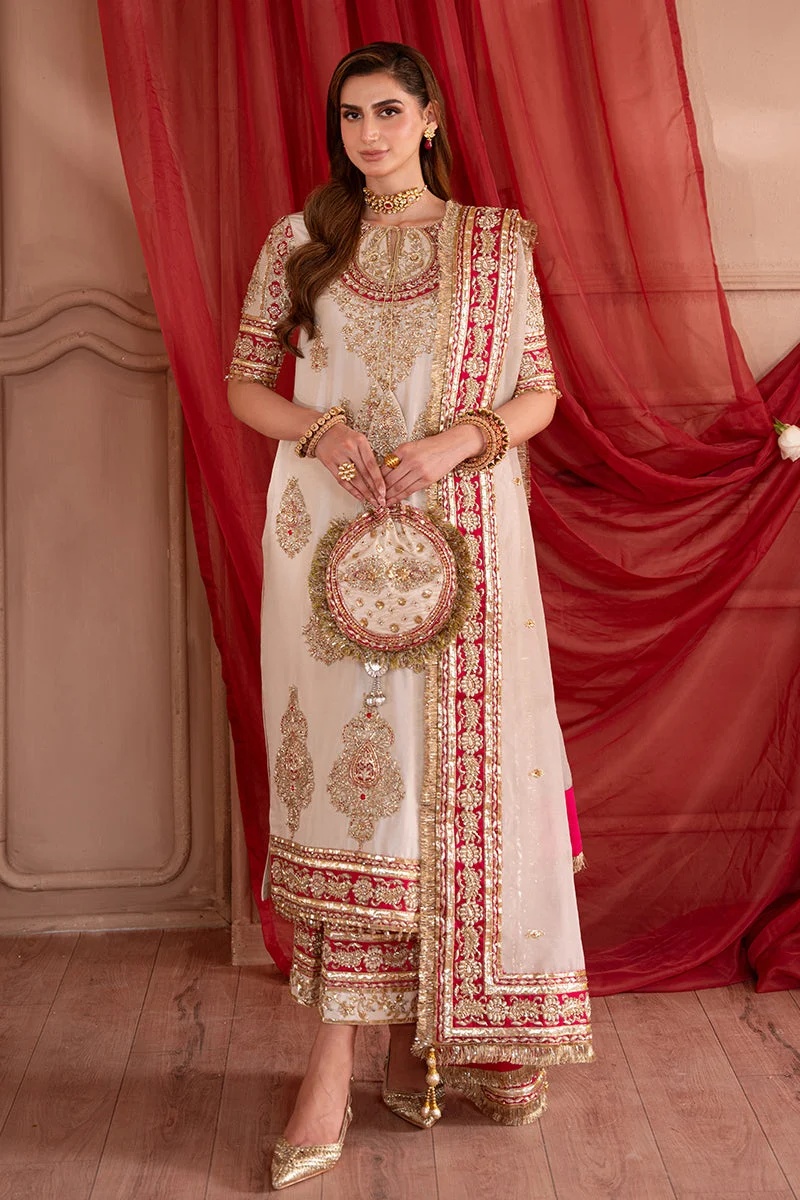 SOLARA Pakistani fashion outfit in gold, pink, red tones.