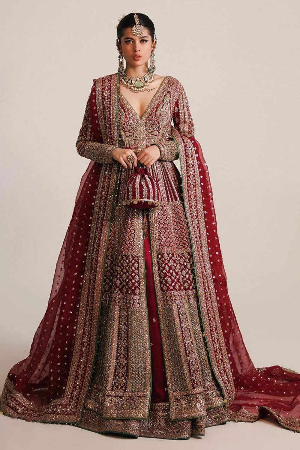 Sarang Pakistani fashion outfit in red, green tones.