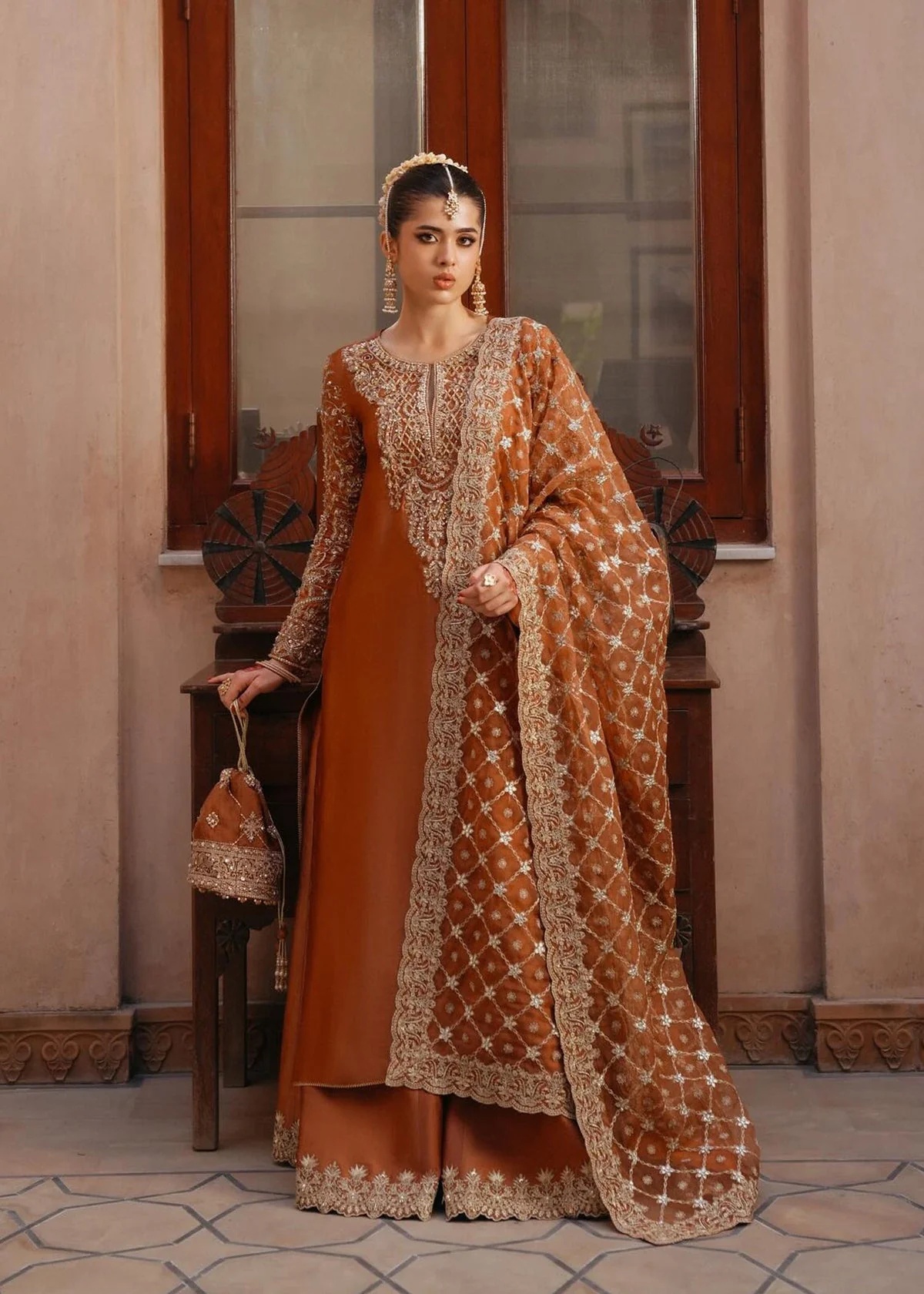 Zulekha pakistani fashion outfit with coordinated formal styling.
