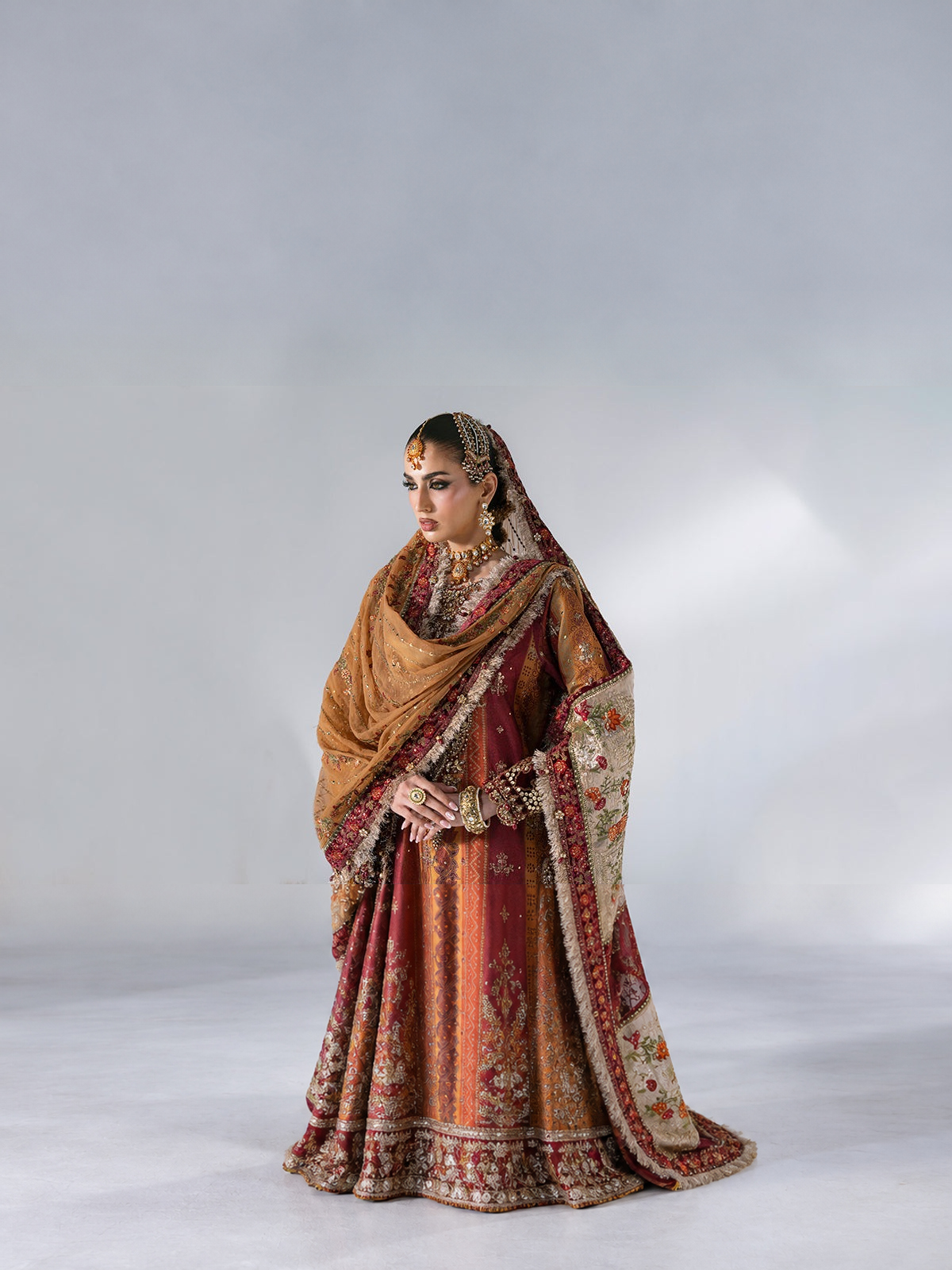 BD-3104 — 3 Piece Unstitched Embroidered Raw Silk Suit. Color: Rust & Maroon.