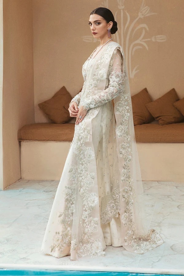 ANYA pakistani fashion outfit in white, pink tones.