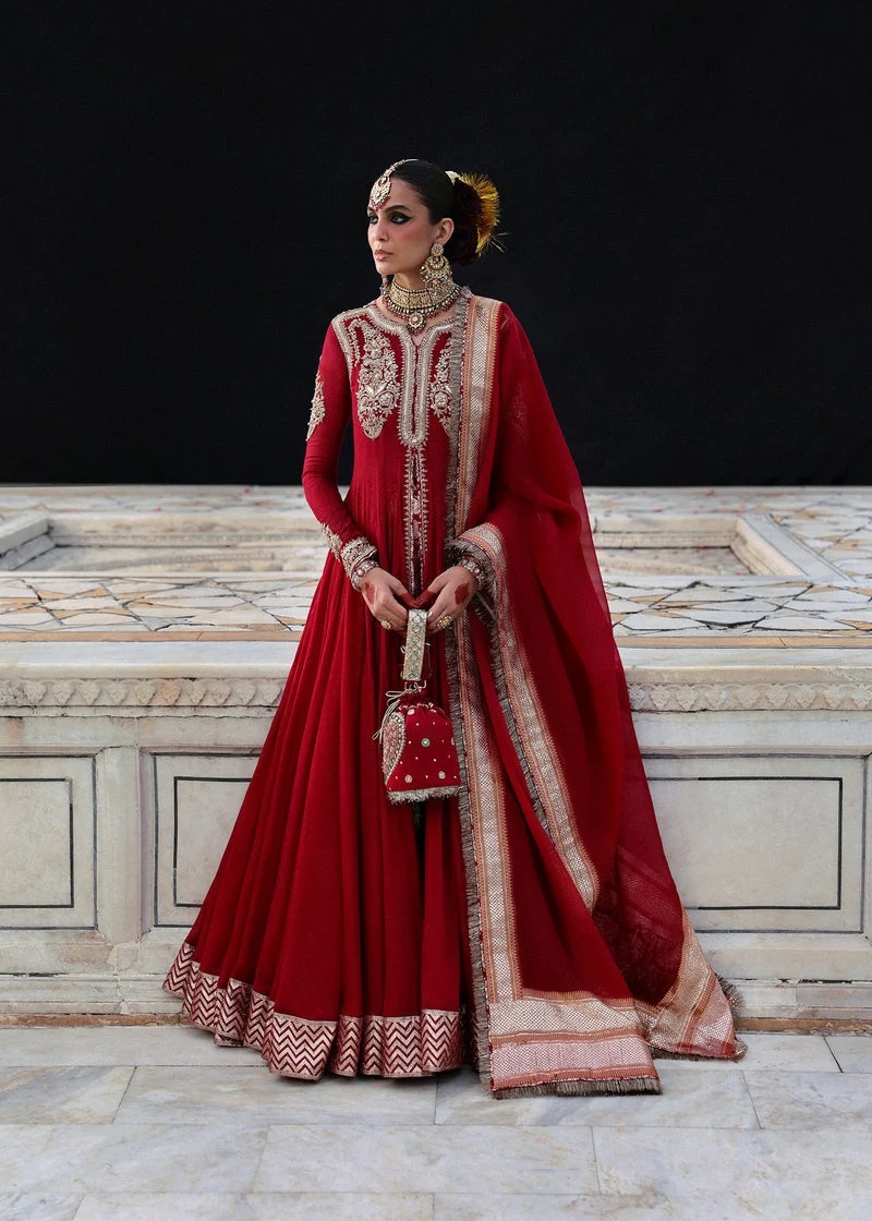 Dilrubah pakistani fashion outfit in red tones.