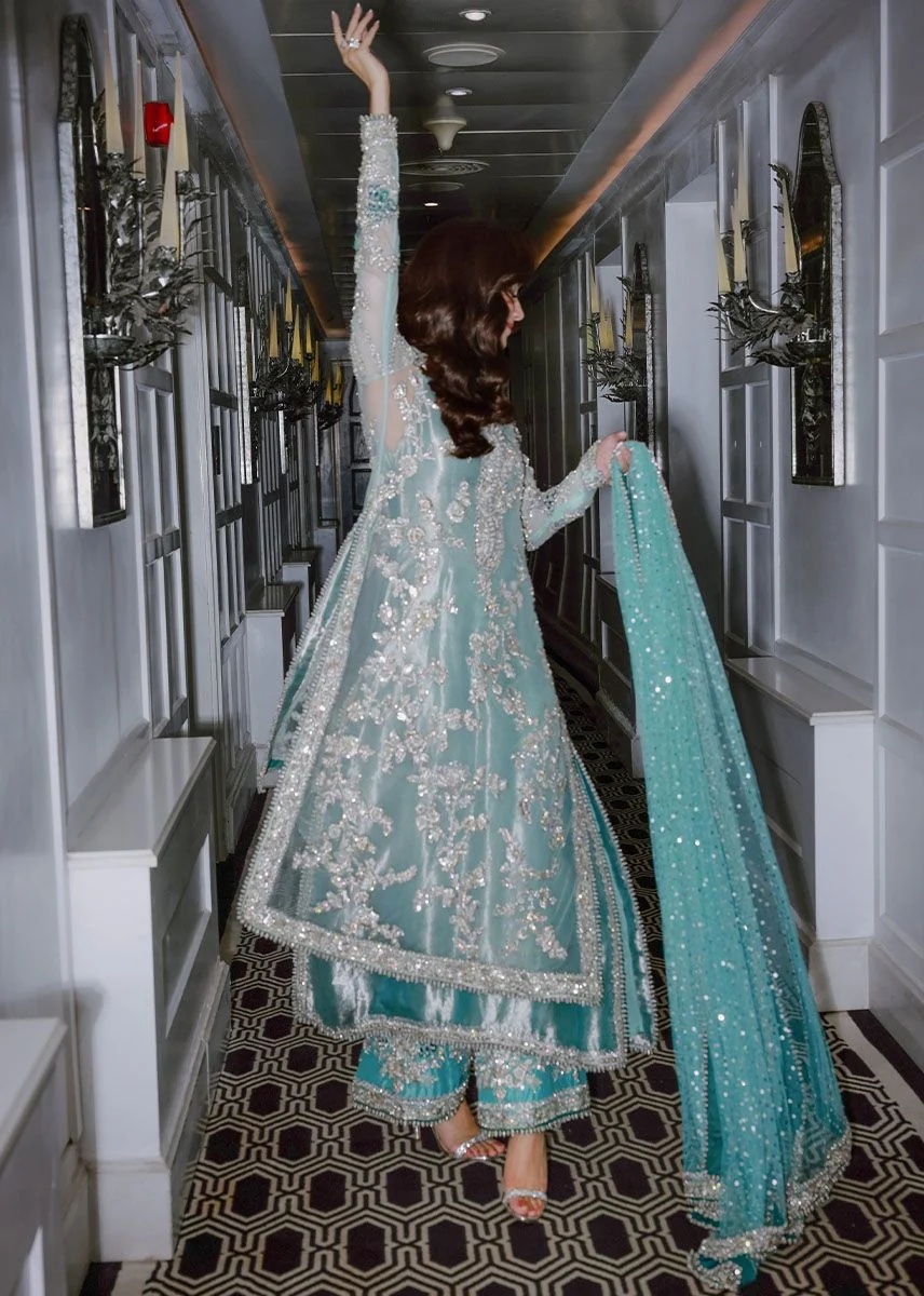Ferozeah pakistani fashion outfit with coordinated formal styling.