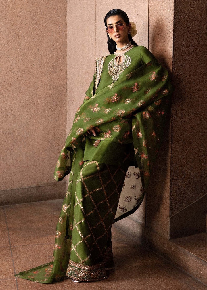 Green-Merlot pakistani fashion outfit in gold, pink, green tones.