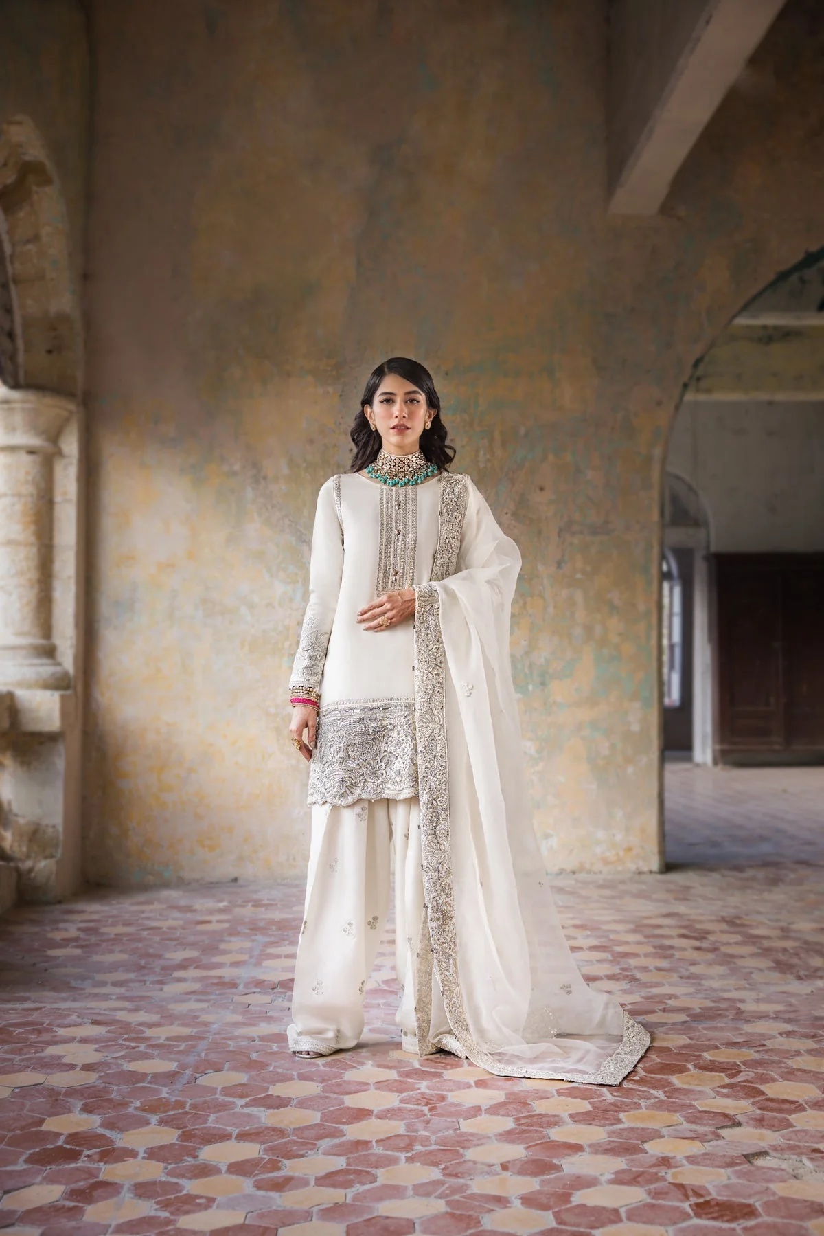 Hoorain pakistani fashion outfit in white, silver tones.