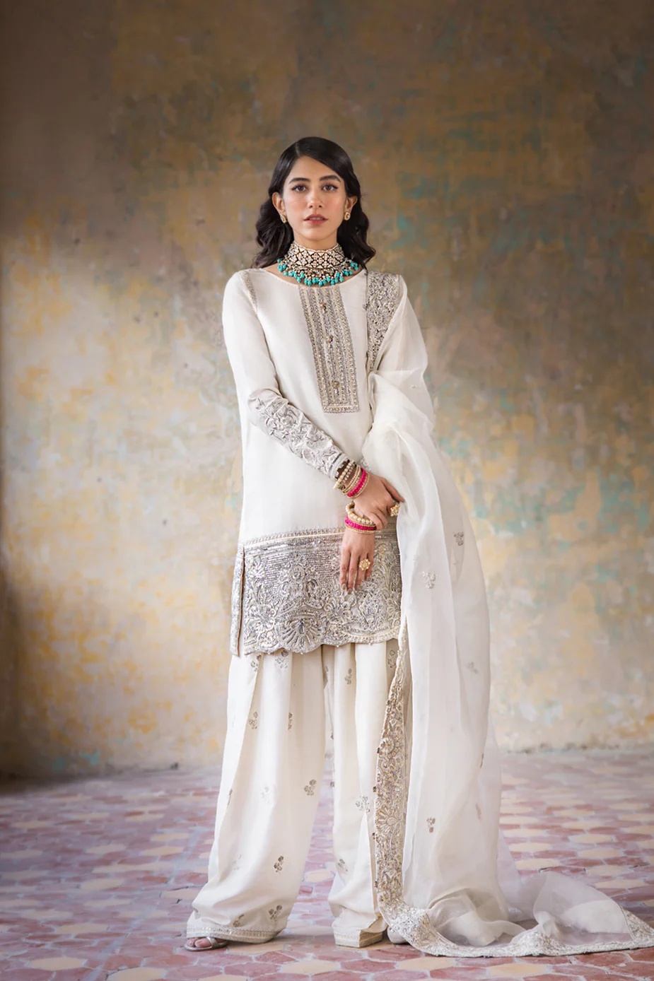 Hoorain pakistani fashion outfit in white, silver tones.