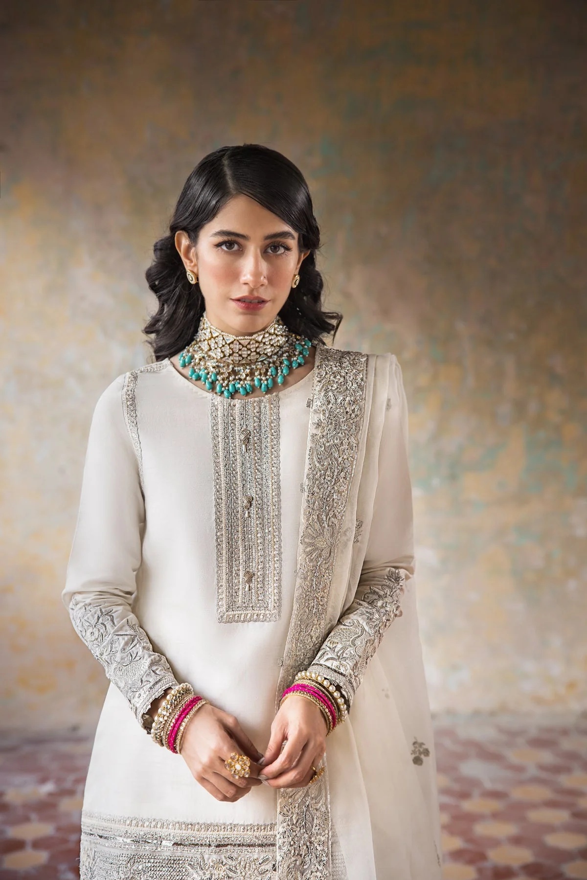 Hoorain pakistani fashion outfit in white, silver tones.