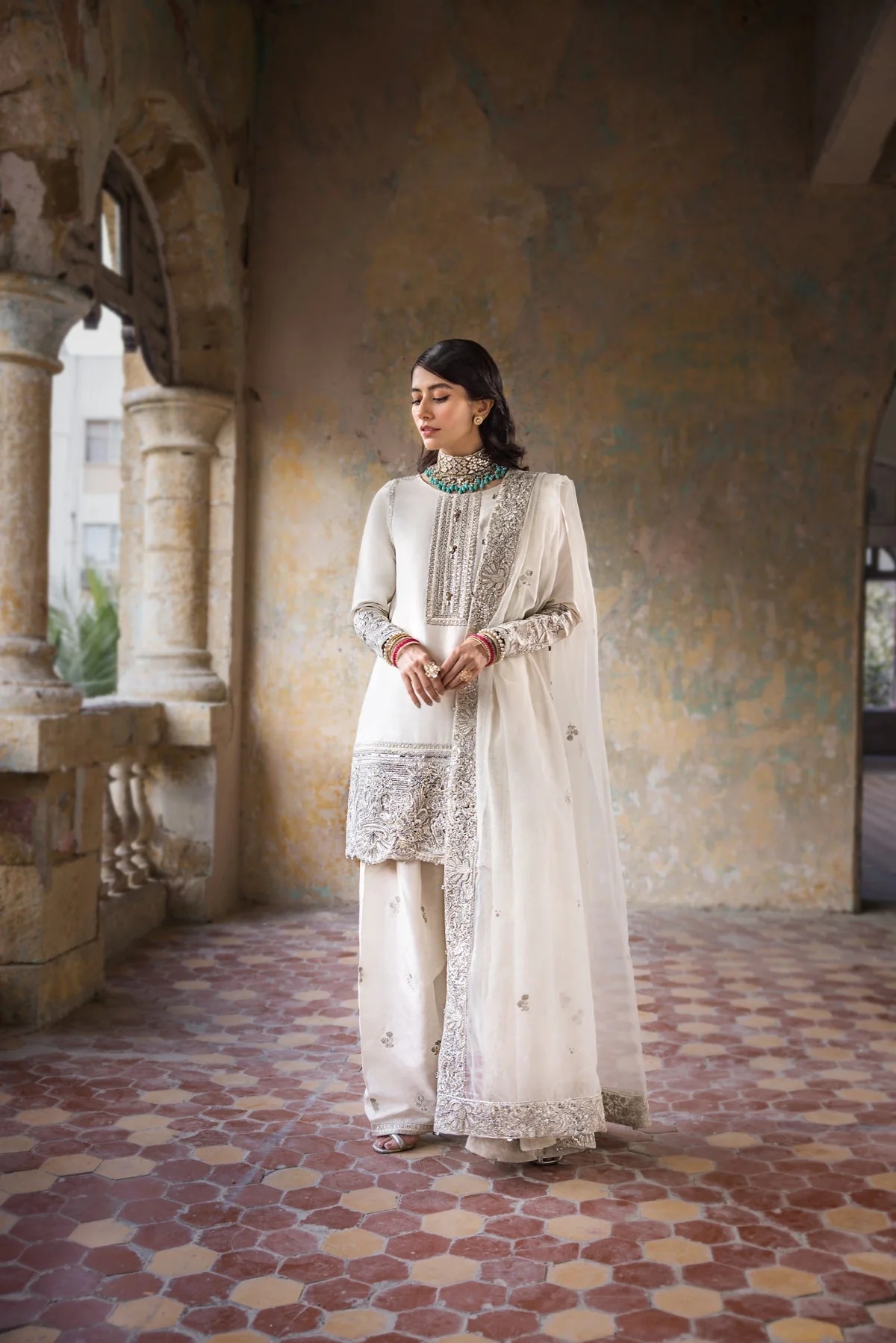 Hoorain pakistani fashion outfit in white, silver tones.