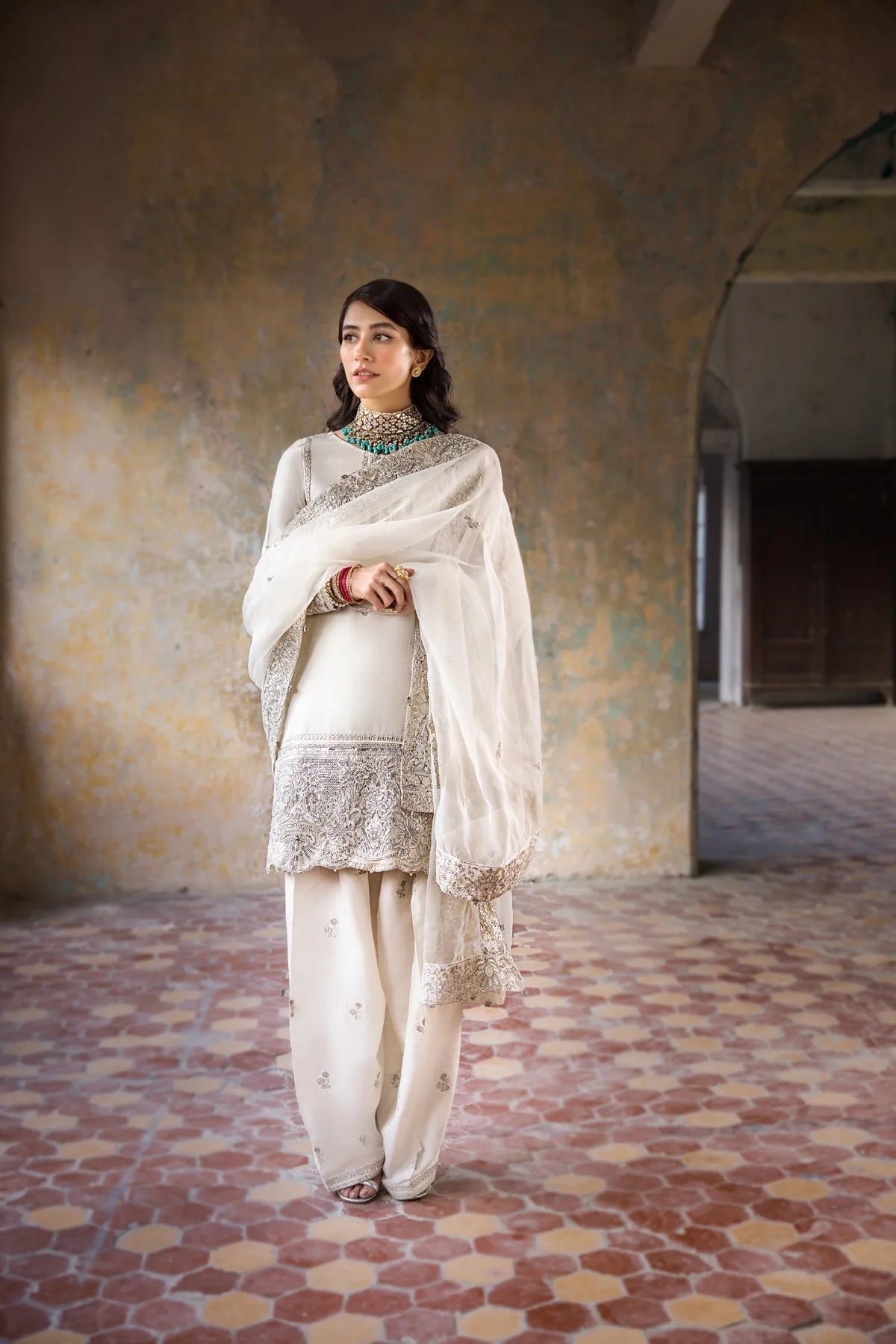 Hoorain pakistani fashion outfit in white, silver tones.
