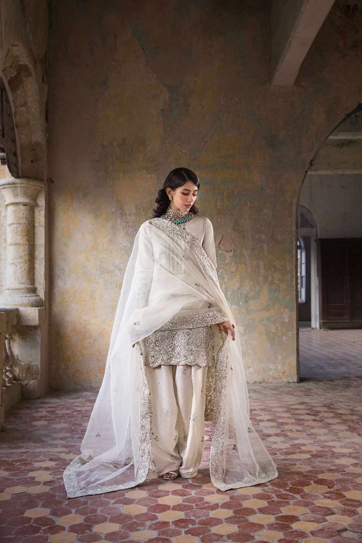 Hoorain pakistani fashion outfit in white, silver tones.
