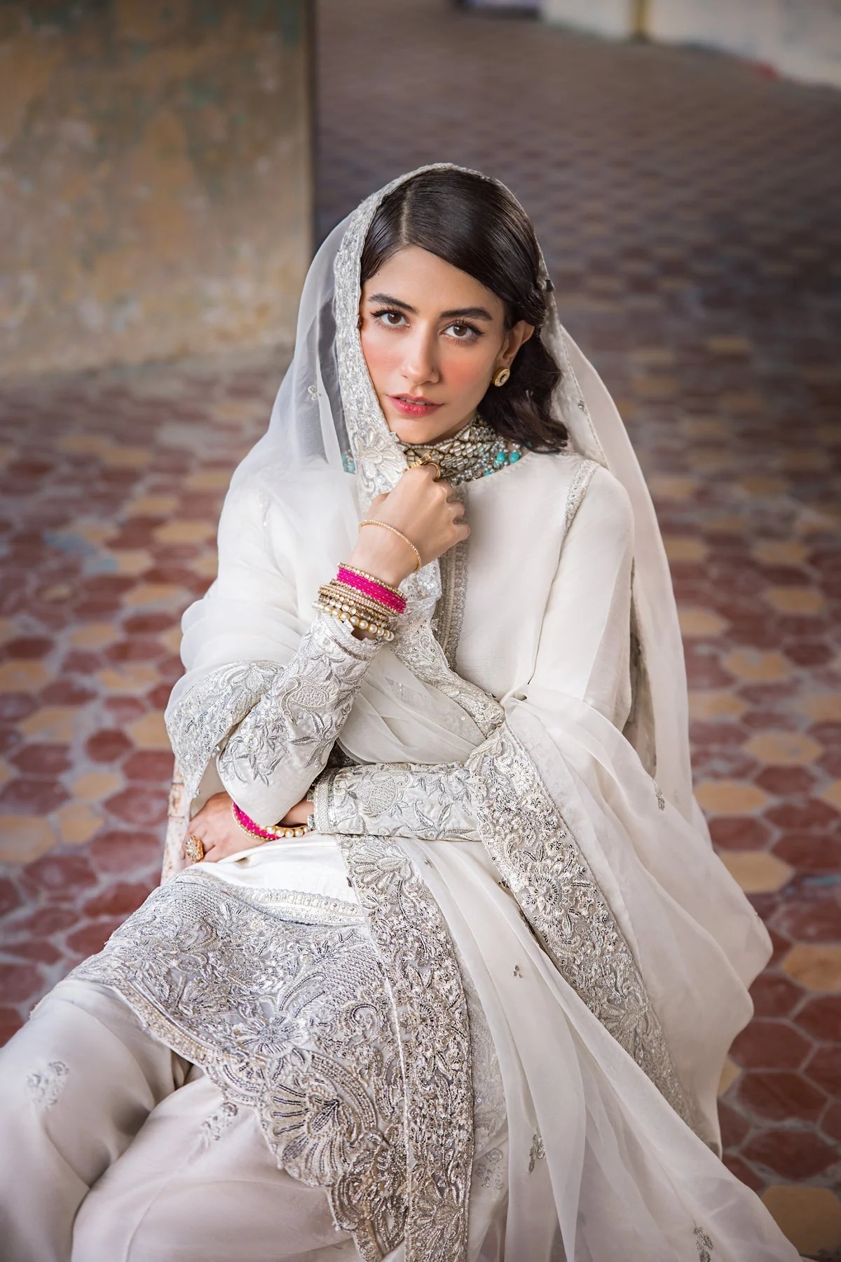 Hoorain pakistani fashion outfit in white, silver tones.