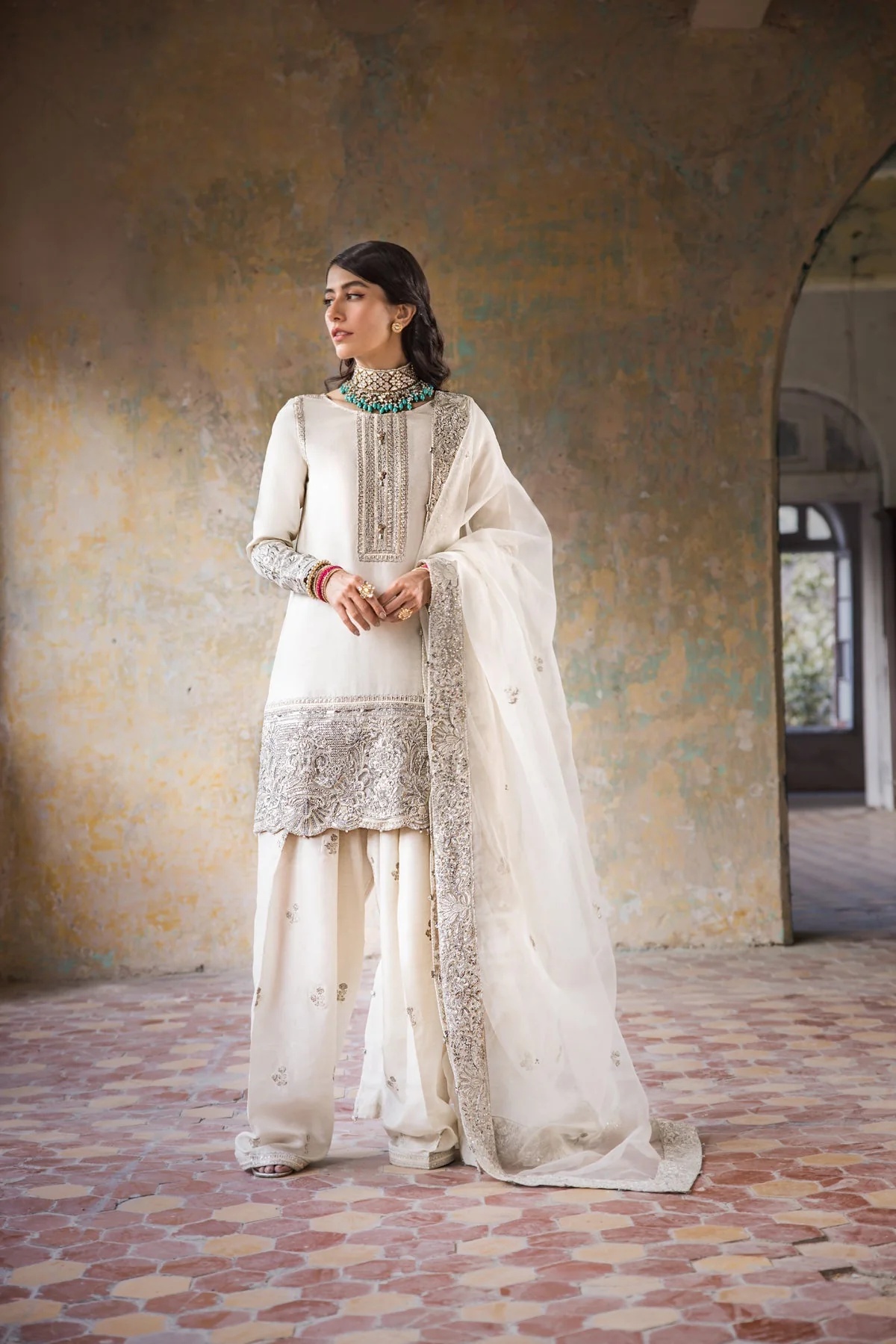Hoorain pakistani fashion outfit in white, silver tones.