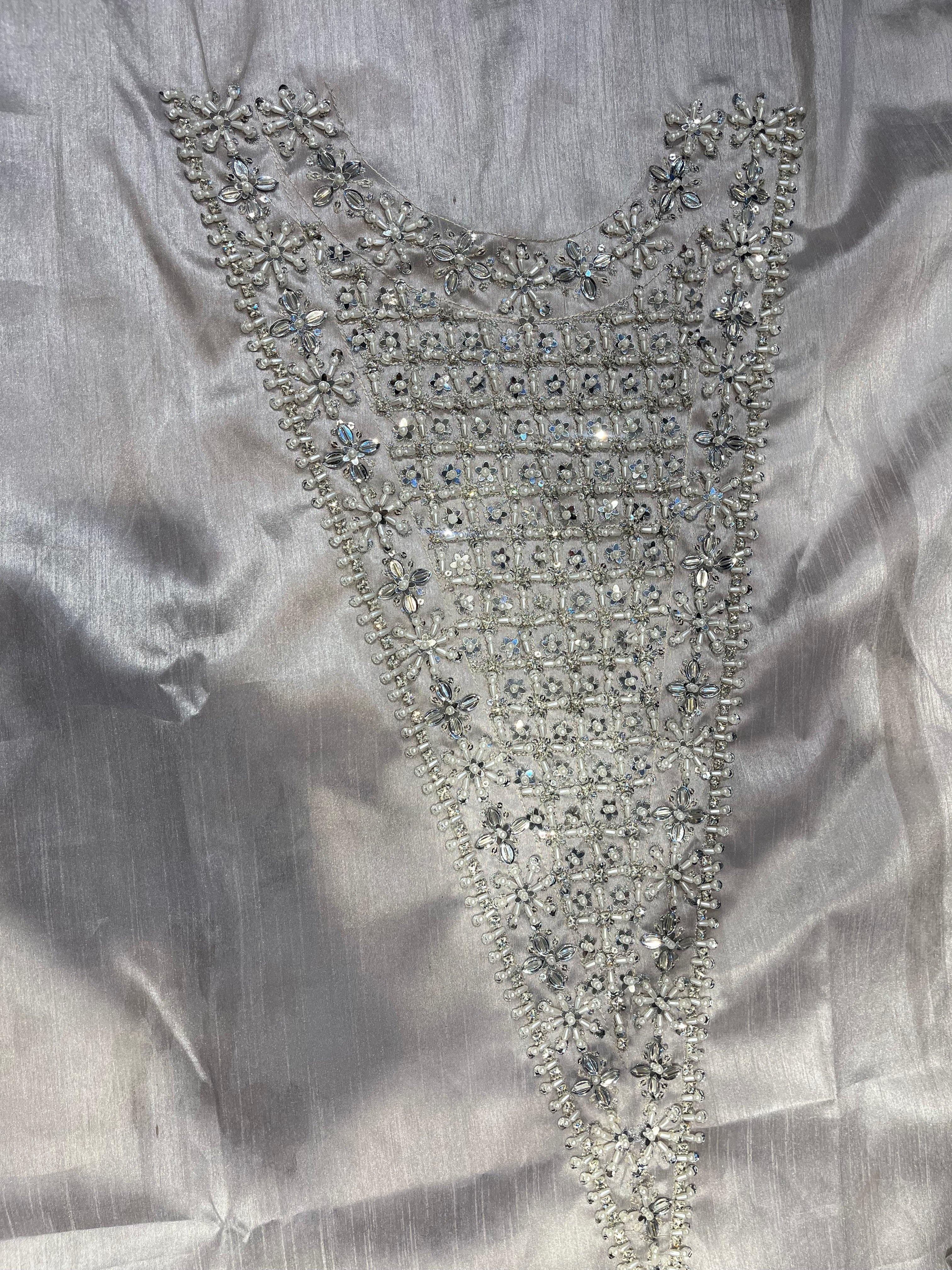 Lucent pakistani fashion outfit in grey, silver tones.