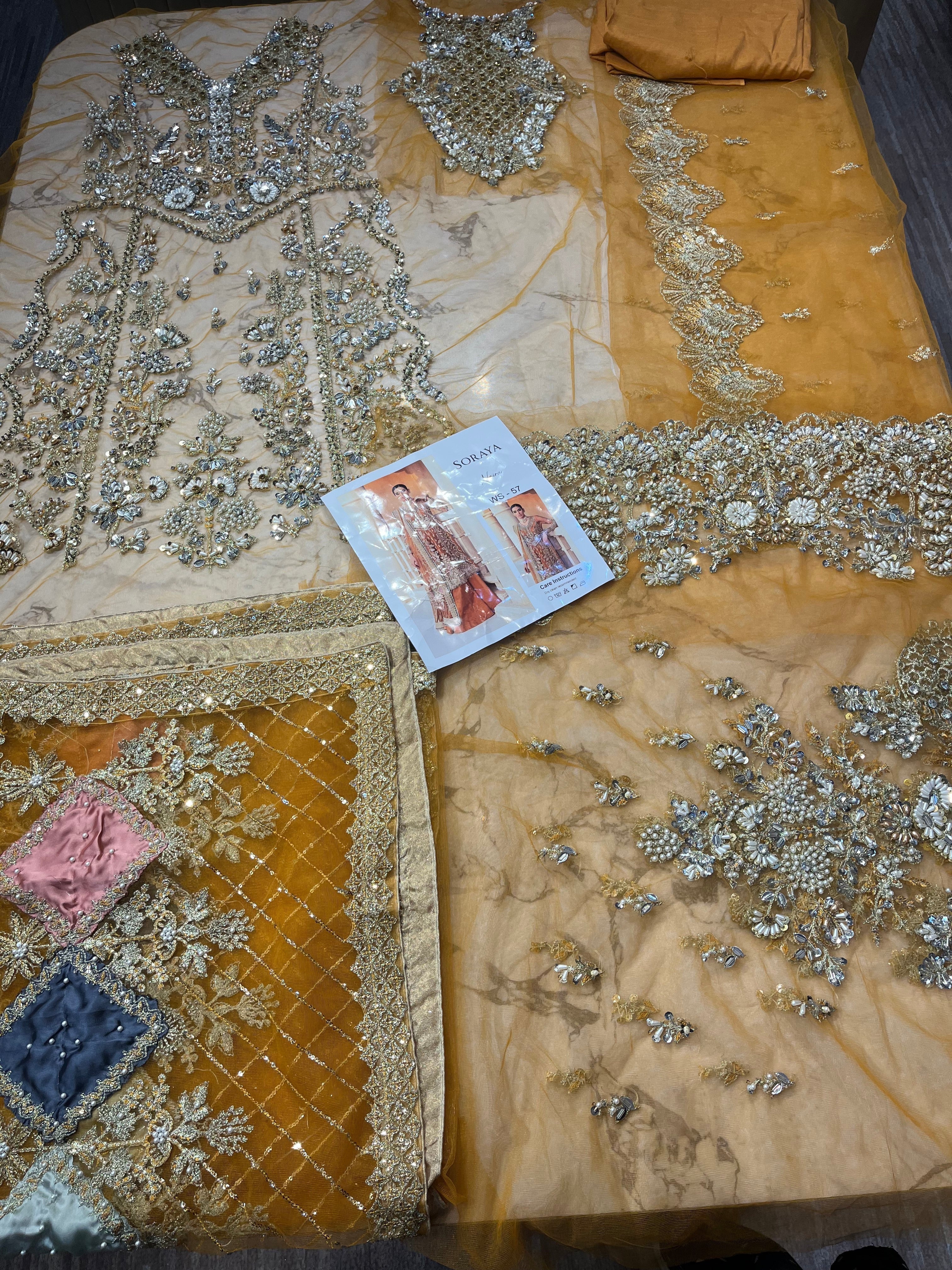 NAIRA pakistani fashion outfit in pink, lilac, rust tones.