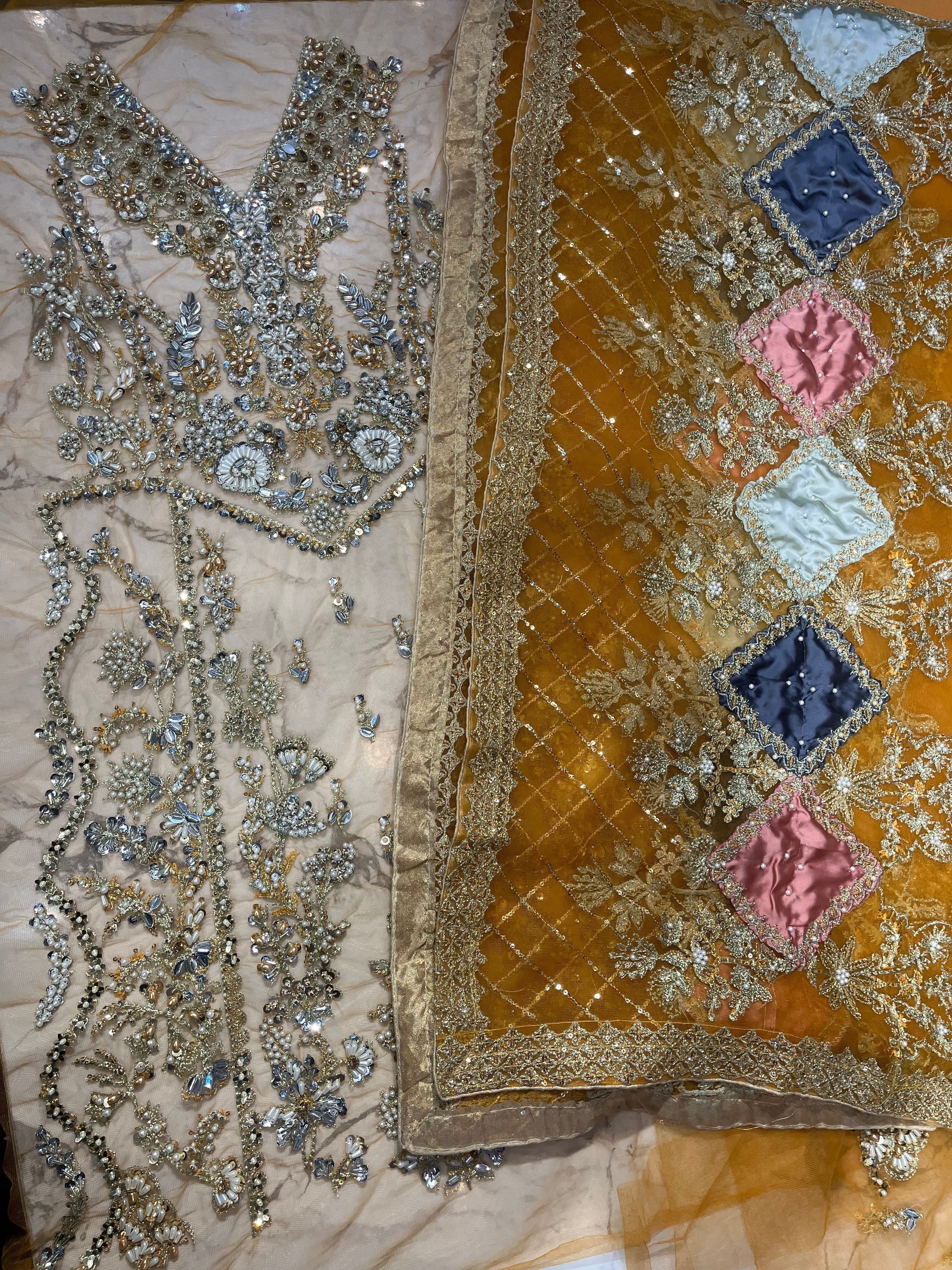 NAIRA pakistani fashion outfit in pink, lilac, rust tones.
