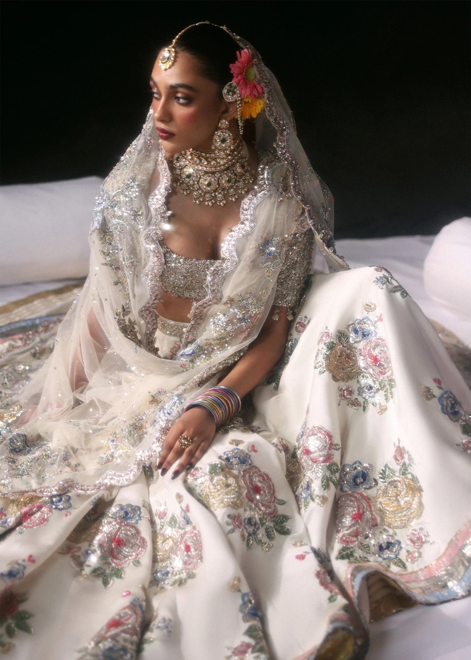 Raks Pakistani fashion outfit in ivory, silver tones.
