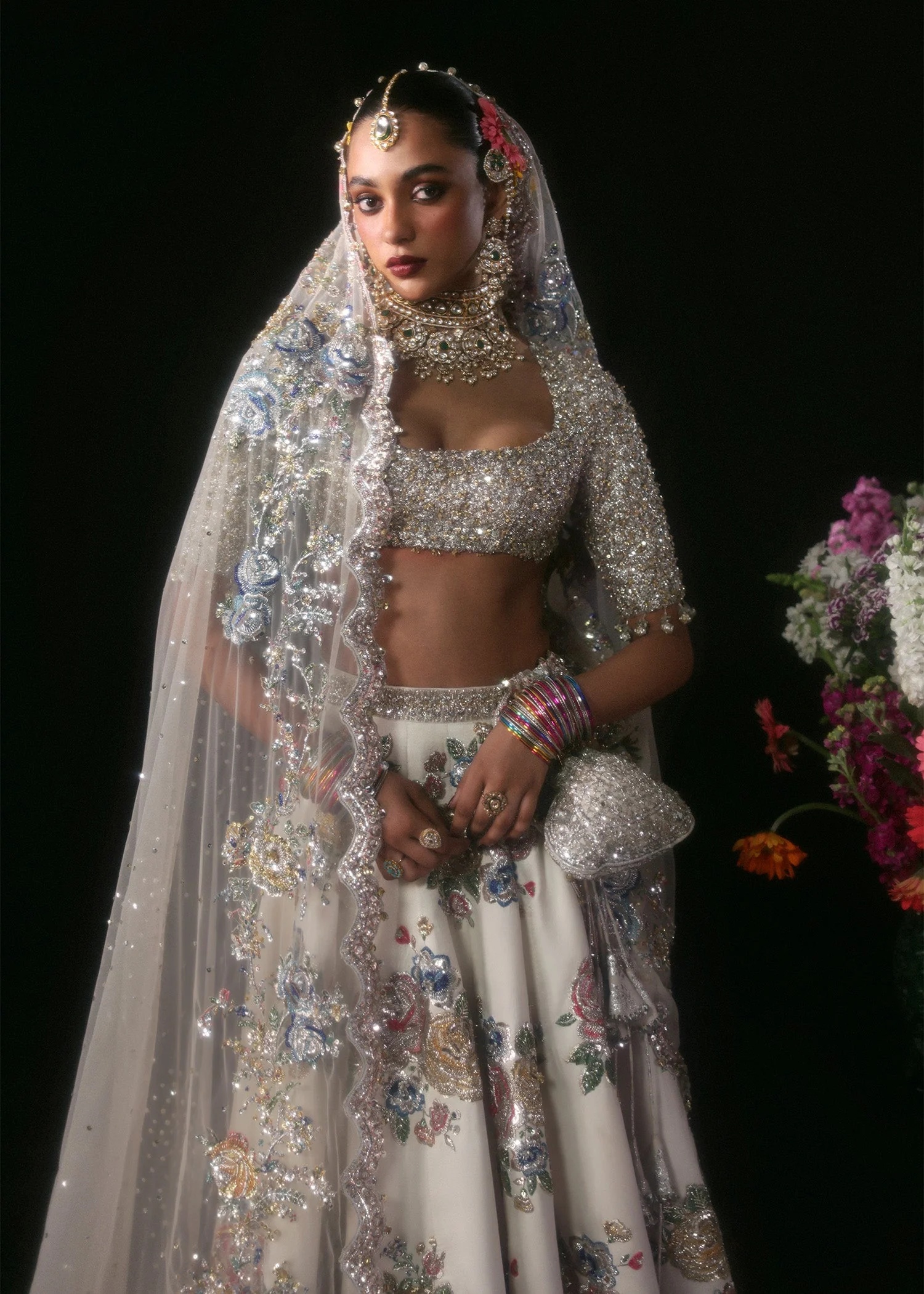 Raks Pakistani fashion outfit in ivory, silver tones.