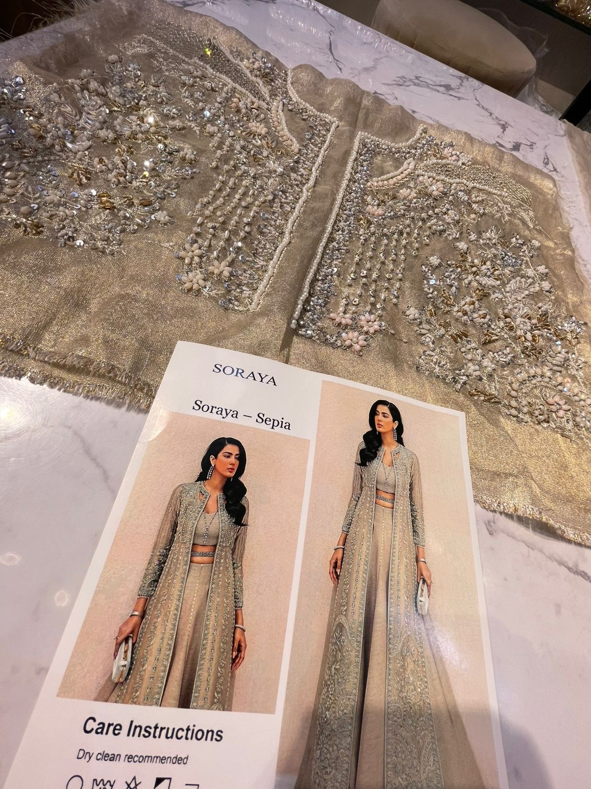 SAPIA pakistani fashion outfit in gold, silver tones.