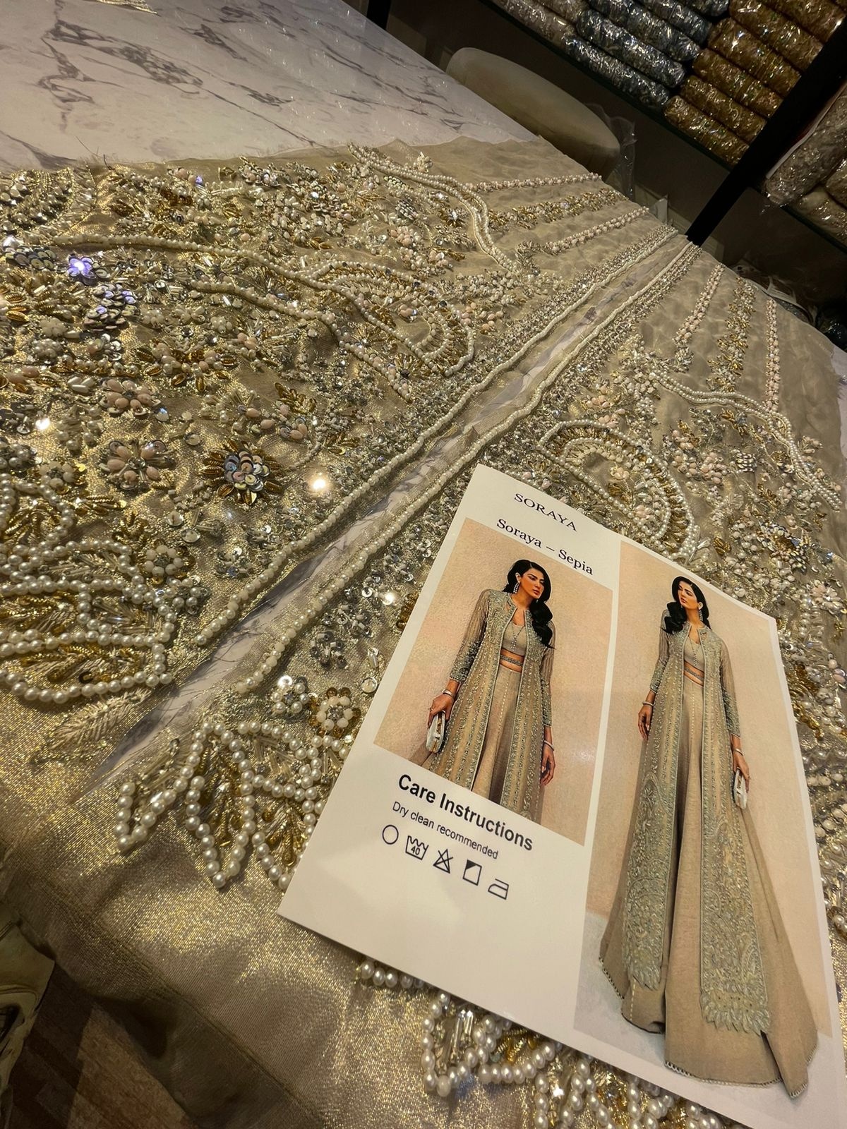 SAPIA pakistani fashion outfit in gold, silver tones.