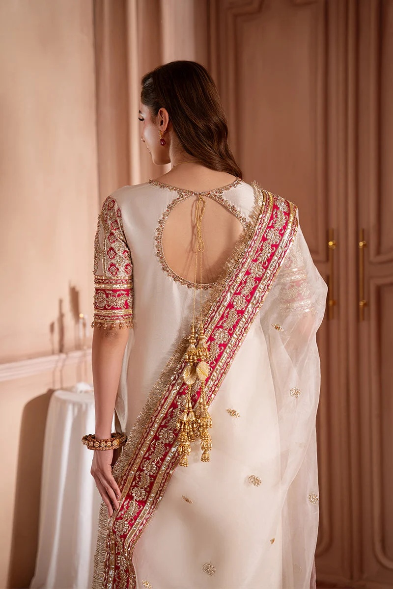 SOLARA Pakistani fashion outfit in gold, pink, red tones.