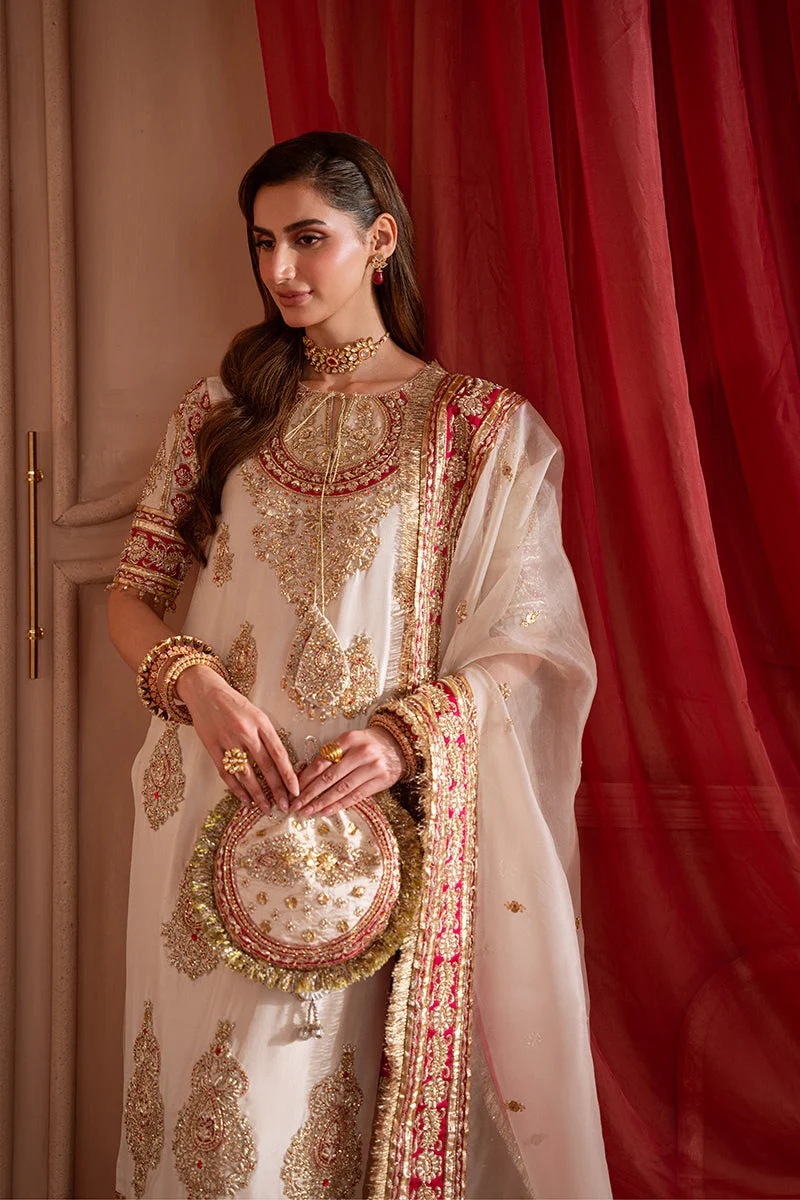 SOLARA Pakistani fashion outfit in gold, pink, red tones.