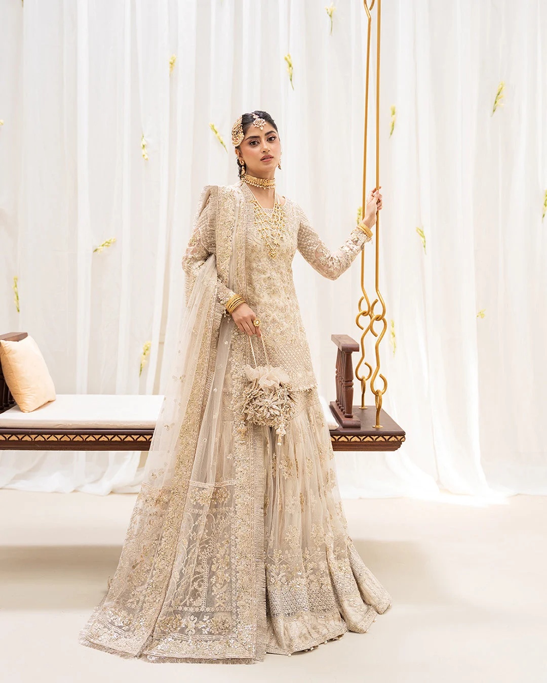 Safak Pakistani fashion outfit in ivory, gold tones.