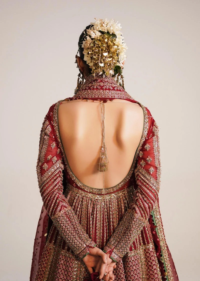 Sarang Pakistani fashion outfit in red, green tones.