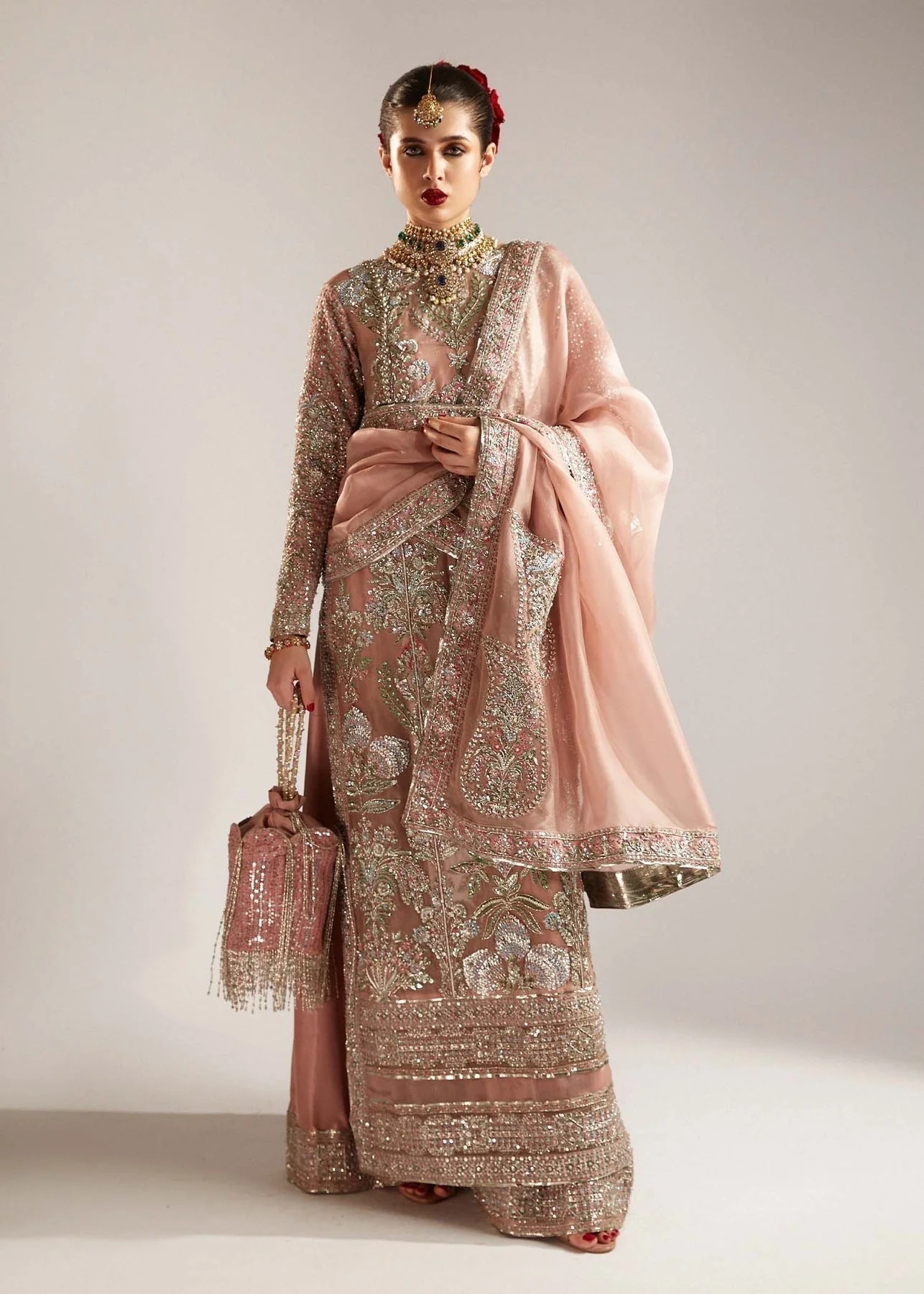 Verve pakistani fashion outfit in pink tones.