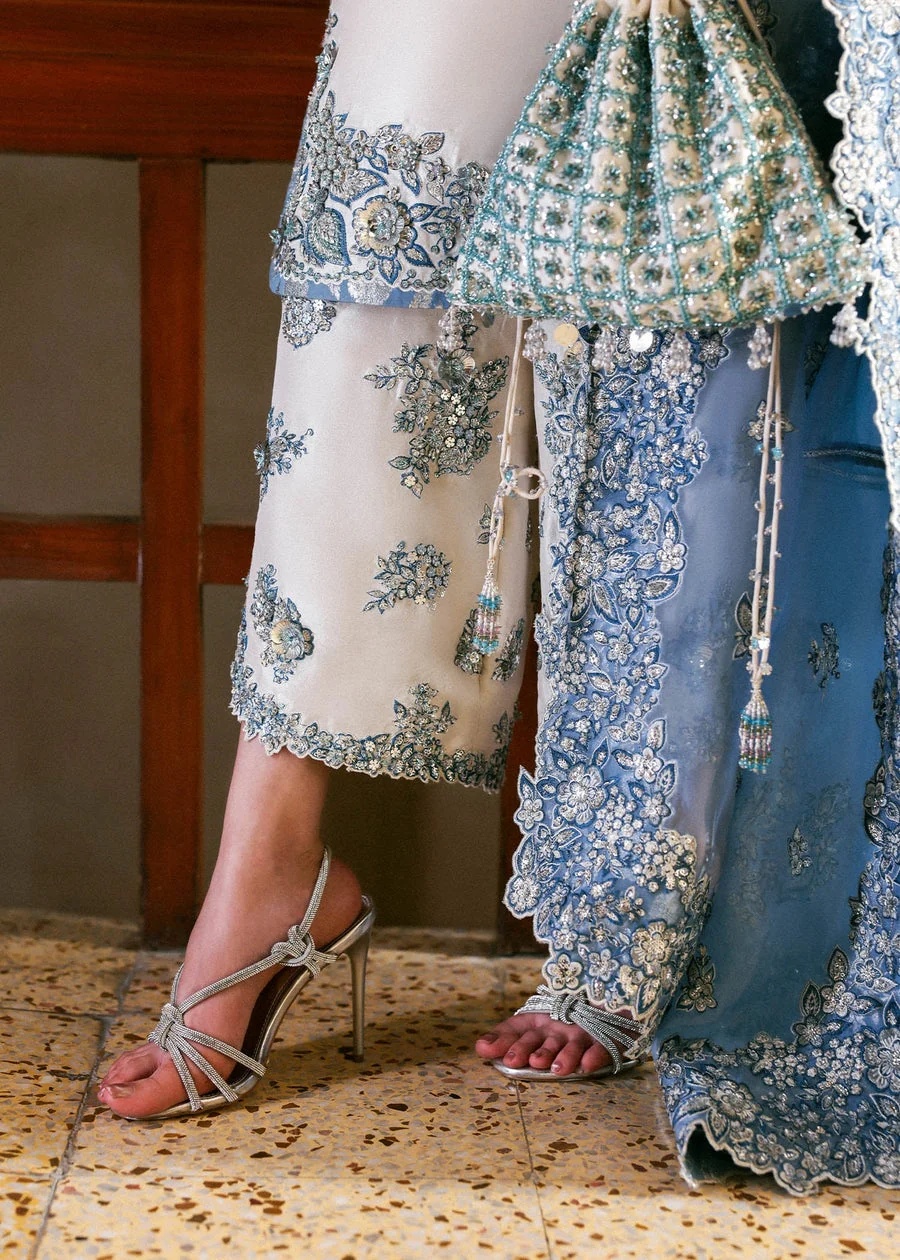 Virelle Pakistani fashion outfit in ivory, blue, silver tones.