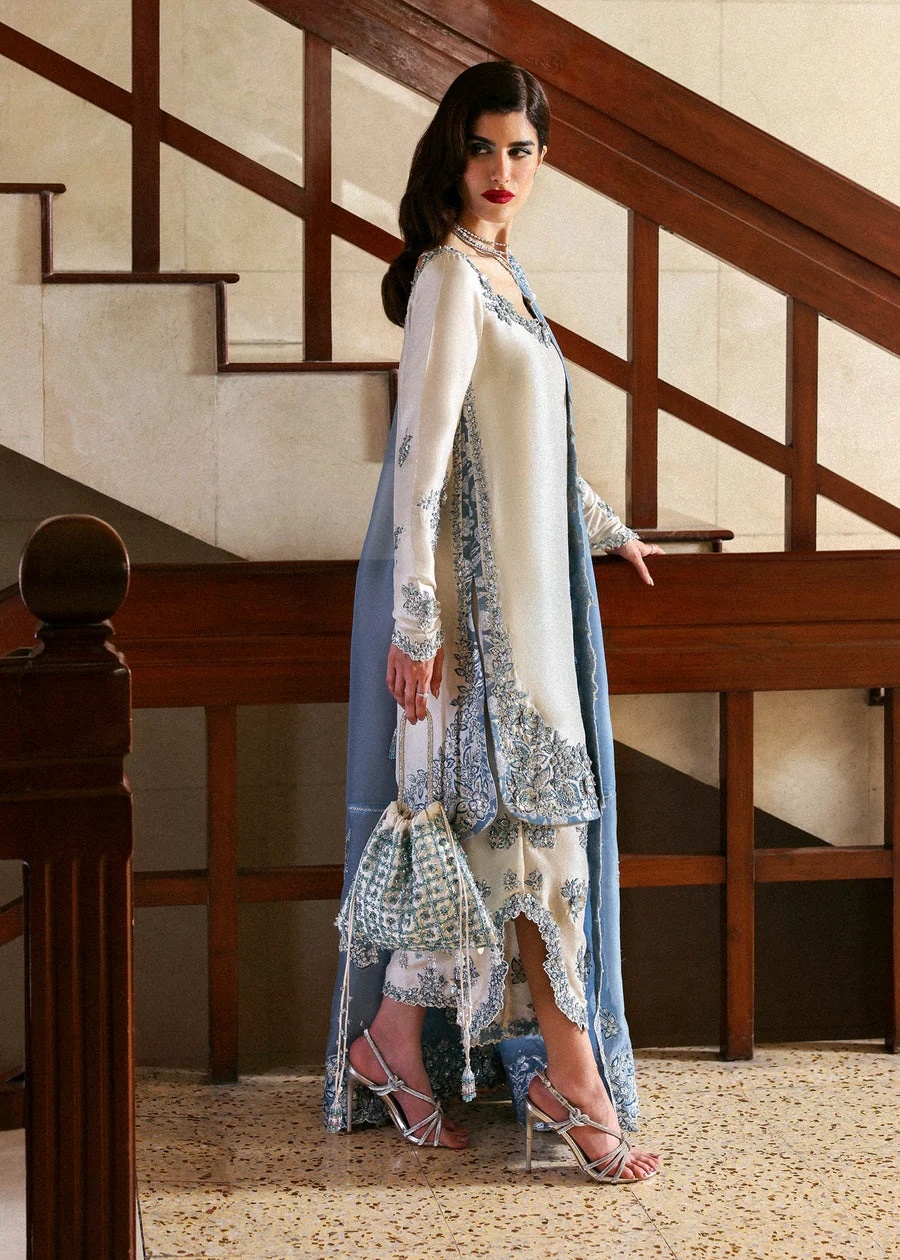 Virelle Pakistani fashion outfit in ivory, blue, silver tones.