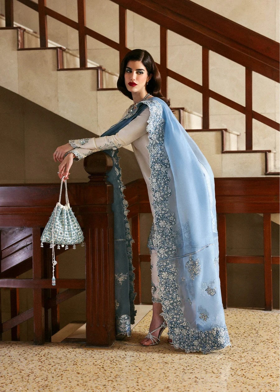 Virelle Pakistani fashion outfit in ivory, blue, silver tones.