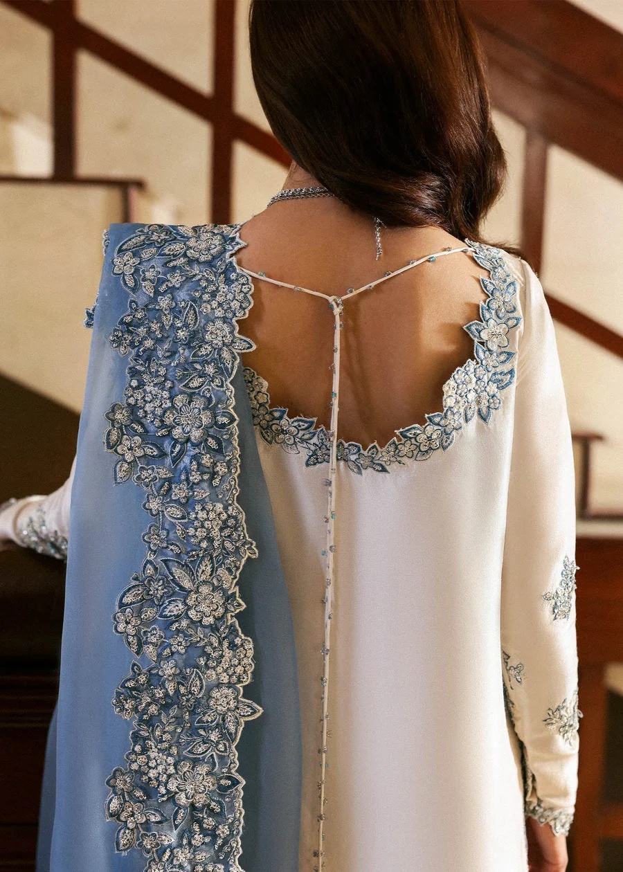 Virelle Pakistani fashion outfit in ivory, blue, silver tones.