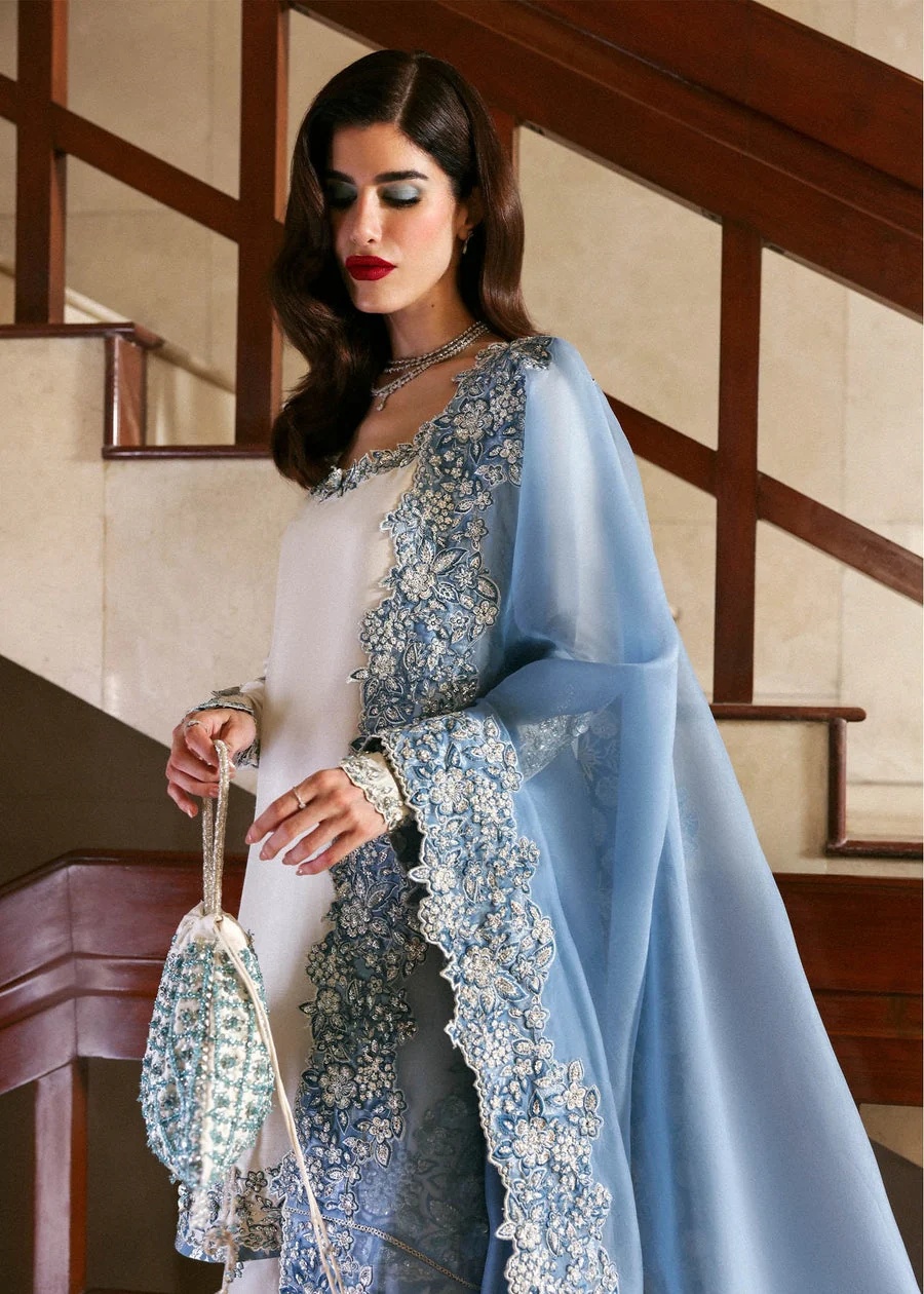 Virelle Pakistani fashion outfit in ivory, blue, silver tones.