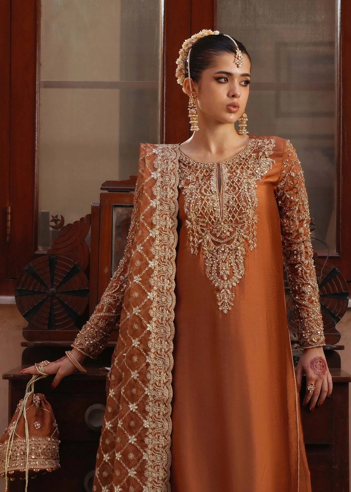 Zulekha pakistani fashion outfit with coordinated formal styling.