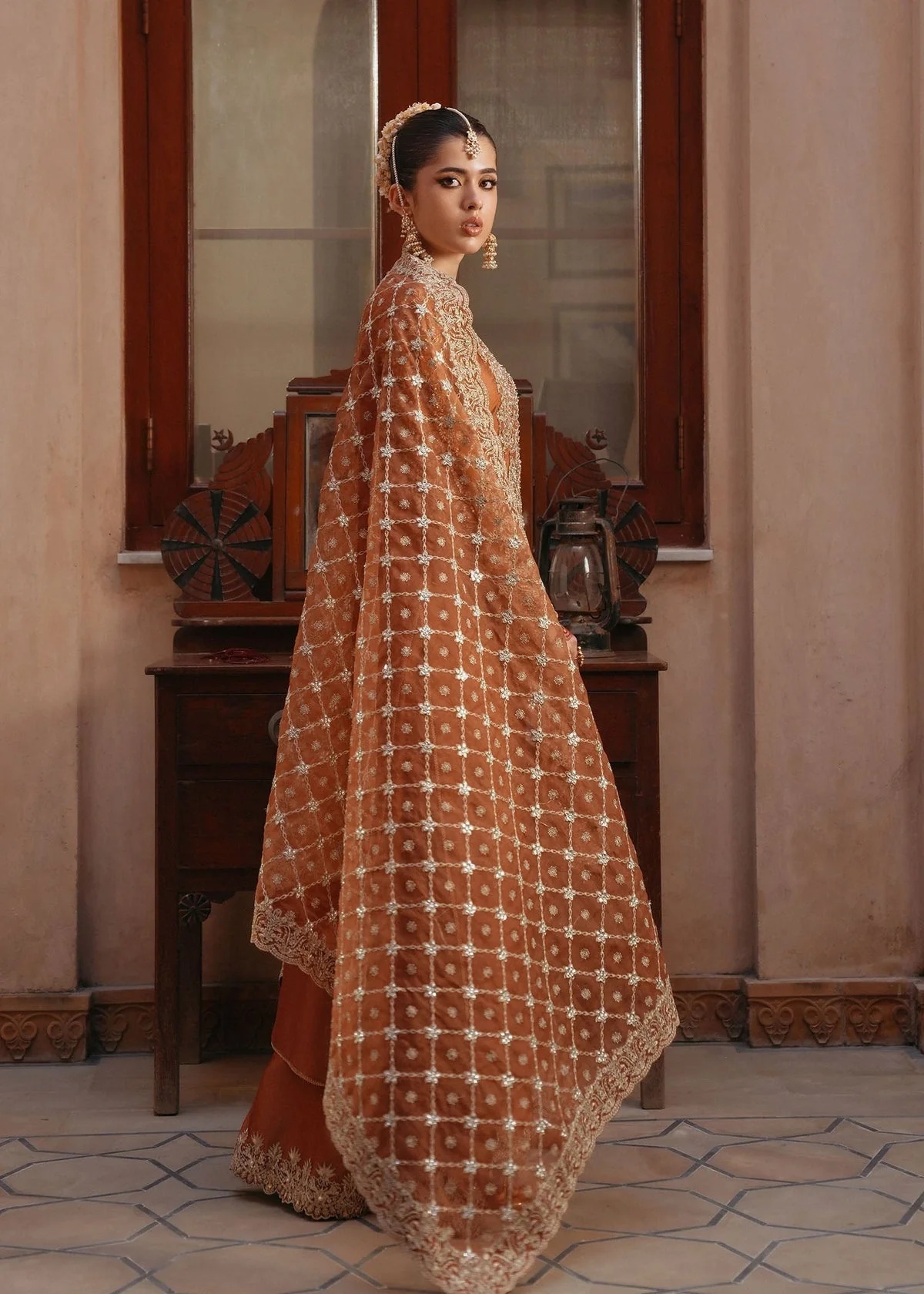 Zulekha pakistani fashion outfit with coordinated formal styling.