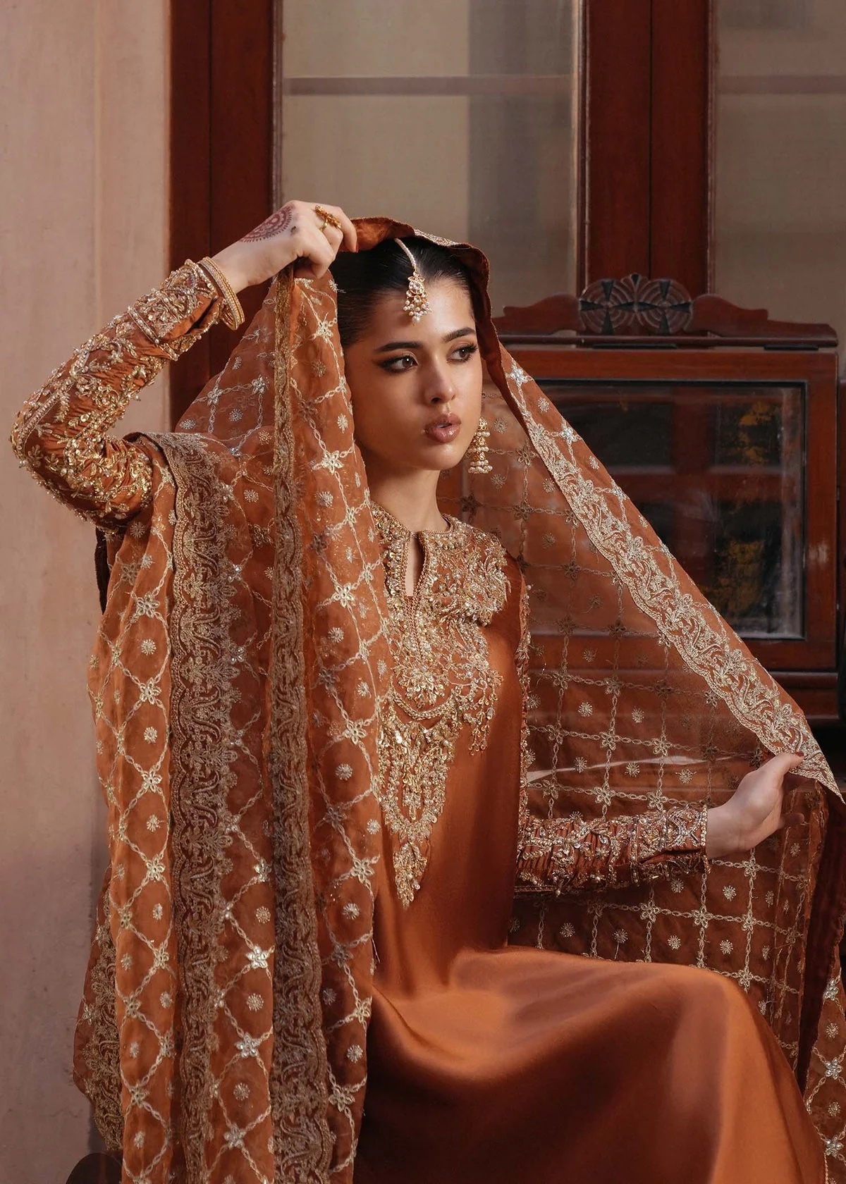 Zulekha pakistani fashion outfit with coordinated formal styling.